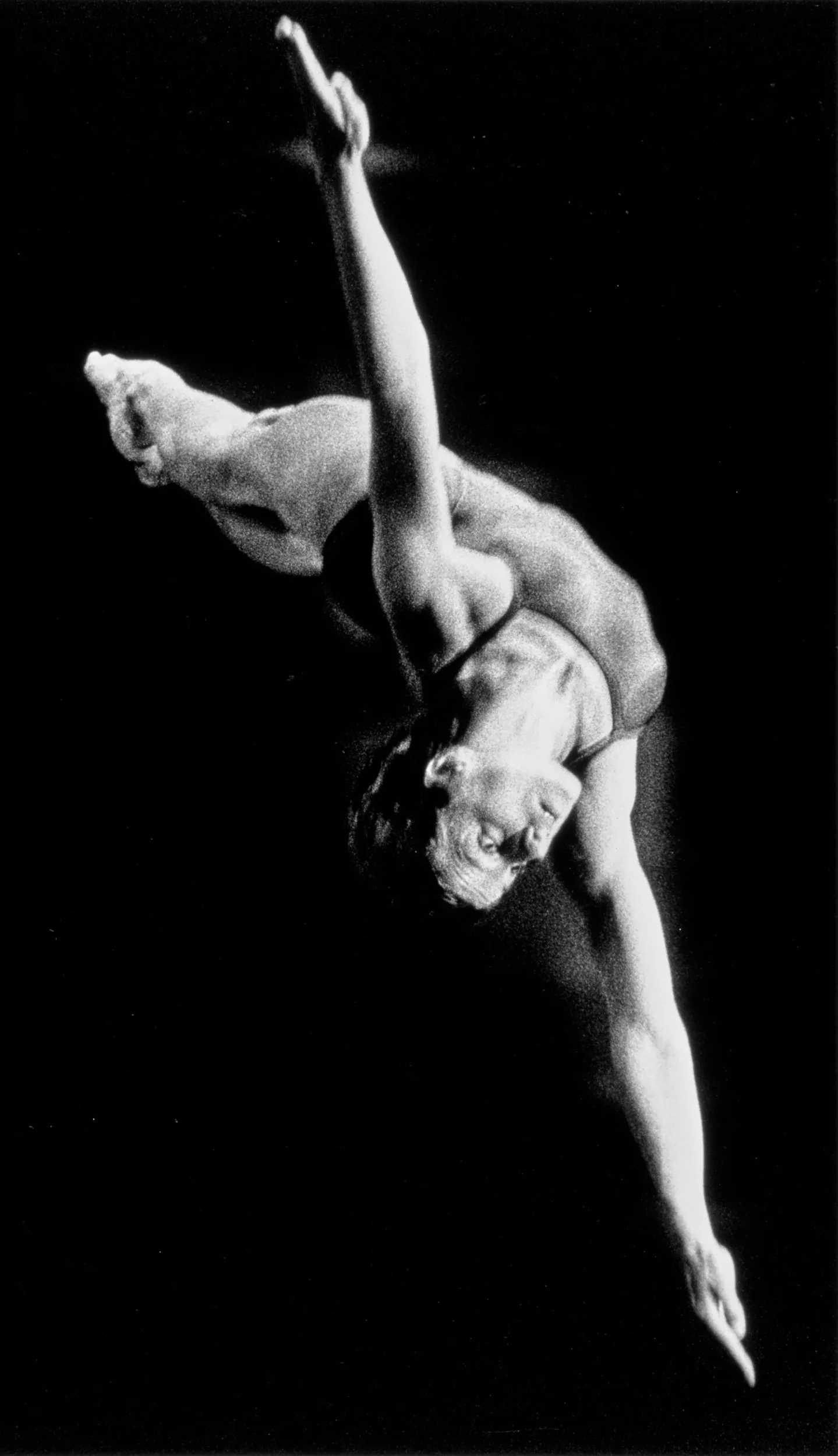 In Flight — United States platform diver Michele Mitchell glides through the air toward the diving pool’s water 10 meter below during the Nation Sports Festival VI held at the Louisiana State University’s newly constructed natatorium on the LSU campus in Baton Rouge, Louisiana.  (Photo by Stephan Savoia)  Published by The Baton Rouge Louisiana State-Times & Morning Advocate Circa July-August 1985