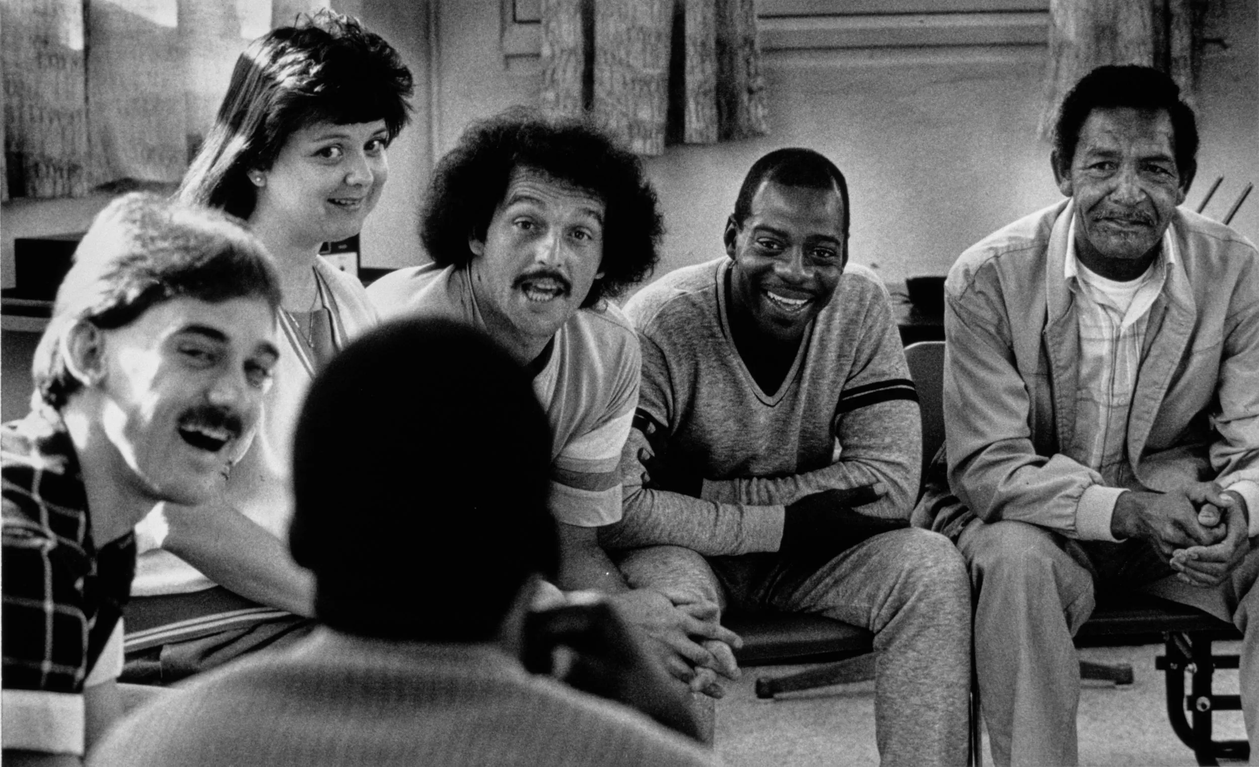 Dig Yourself — Addicts Take Hard Road Back To Life - Blue Waters is a 28-day in residence four week addiction treatment program where residences participate in encounter group sessions each morning throughout their stay. Third week group members Michael Hall, left to right, John Rushing, Cyrus Chaney and Abner Batiste confront a group member responding to his denial with laughter. Group counselor Susan Hodas, second from left, casts a skeptical expression toward the unnamed group member’s explanation.  Photo by Stephan Savoia  Published by the Baton Rouge Louisiana State-Times & Morning Advocate on November 27, 1989